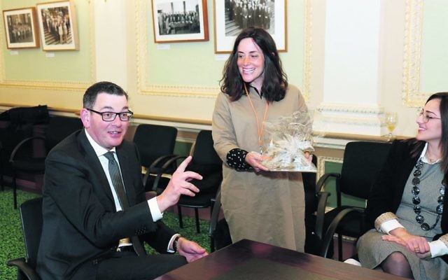 Rebbetzin Dina Kahn presents Premier Daniel Andrews with a gift on behalf of the RCV. Photo: Peter Haskin Rebbetzin Dina Kahn presents Premier Daniel Andrews with a gift on behalf of the RCV. Photo: Peter Haskin