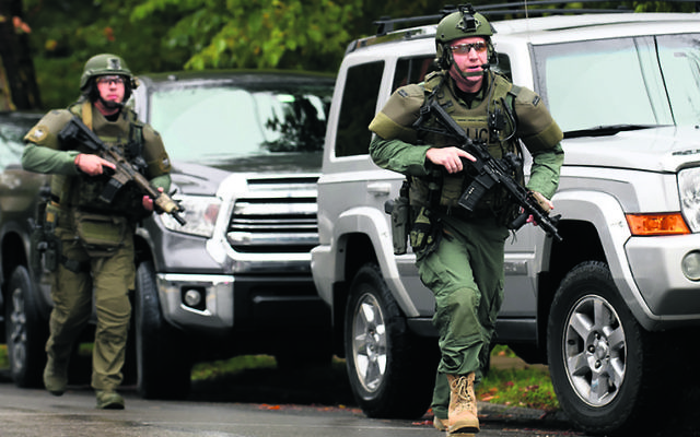 Police responding to the shooting at the Tree of Life synagogue.
Photo: Jeff Swensen/Getty Images Police responding to the shooting at the Tree of Life synagogue.
Photo: Jeff Swensen/Getty Images