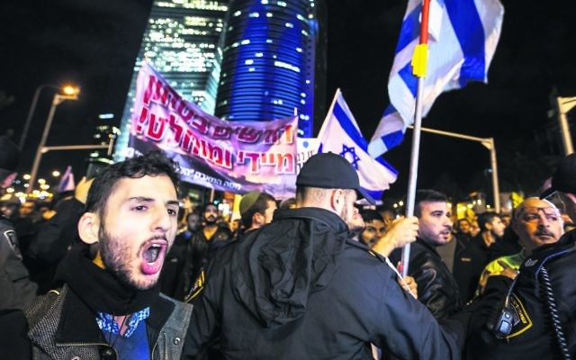 Protesters in Tel Aviv demonstrating against the government. Photo: EPA/Jim Hollander Protesters in Tel Aviv demonstrating against the government. Photo: EPA/Jim Hollander