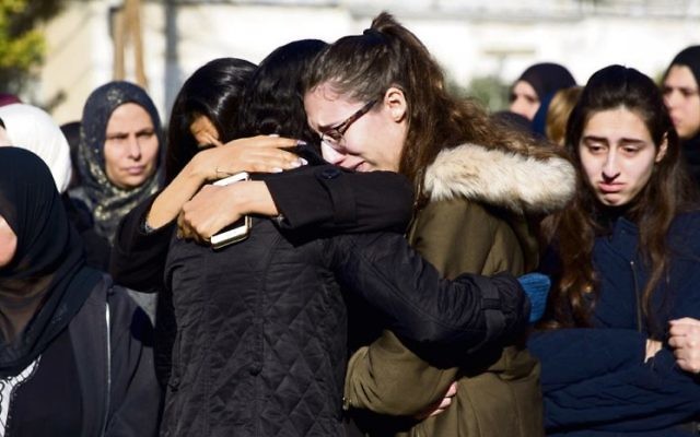 Mourners at the funeral of Aiia Maasarwe in Israel last week. Photo: AP Photo/Ariel Schalit Mourners at the funeral of Aiia Maasarwe in Israel last week. Photo: AP Photo/Ariel Schalit