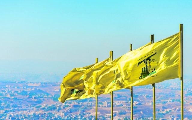 Hezbollah flags in southern Lebanon. The UK will be banning Hezbollah in its entirety, not just its military wing. Photo: John Grummet/Dreamstime.com Hezbollah flags in southern Lebanon. The UK will be banning Hezbollah in its entirety, not just its military wing. Photo: John Grummet/Dreamstime.com