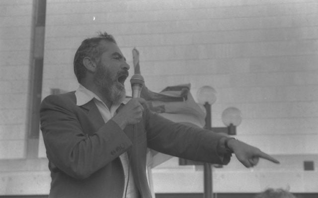 Meir Kahane addresses his followers during a demonstration in Jerusalem in 1984.
Photo: Nati Harnik/GPO Meir Kahane addresses his followers during a demonstration in Jerusalem in 1984.
Photo: Nati Harnik/GPO