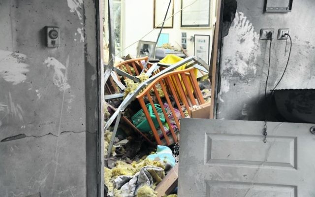 An Israeli house hit by a Hamas rocket this week. Photo: Israel Police An Israeli house hit by a Hamas rocket this week. Photo: Israel Police