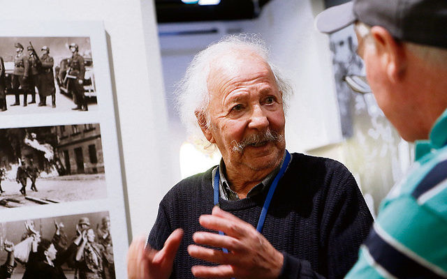 Henri Korn, Holocaust survivor and guide at the Jewish Holocaust Centre, speaks with visitors. Photo: Peter Haskin Henri Korn, Holocaust survivor and guide at the Jewish Holocaust Centre, speaks with visitors. Photo: Peter Haskin
