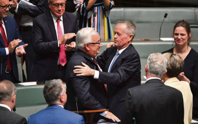 Applause for Michael Danby and an embrace from Opposition Leader Bill
Shorten last week. Photo: AAP Image/Mick Tsikas Applause for Michael Danby and an embrace from Opposition Leader Bill
Shorten last week. Photo: AAP Image/Mick Tsikas