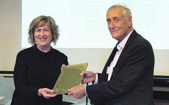 Queensland State Librarian Vicki McDonald accepts a building committee
minute book of the Brisbane Hebrew Congregation from Dr Michael Briner. Queensland State Librarian Vicki McDonald accepts a building committee
minute book of the Brisbane Hebrew Congregation from Dr Michael Briner.
