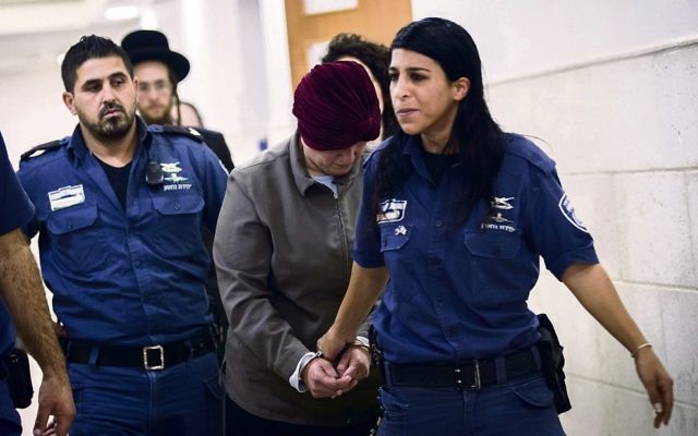 Malka Leifer being led into the Jerusalem District court last February.
Photo: EPA Malka Leifer being led into the Jerusalem District court last February.
Photo: EPA