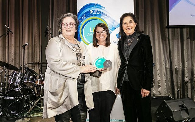 Claire Gil-Munoz (centre) and Isabelle Shapiro (right) accepting the award from Cathy Tobin at the National Suicide
Prevention Conference on July 23. Photo: Raimond Aide Claire Gil-Munoz (centre) and Isabelle Shapiro (right) accepting the award from Cathy Tobin at the National Suicide
Prevention Conference on July 23. Photo: Raimond Aide