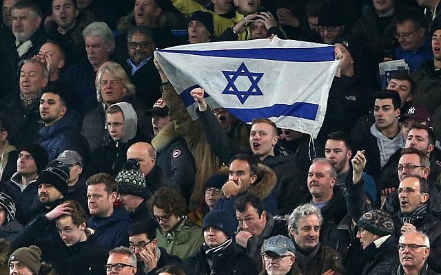 Soccer supporters hold an Israeli flag during a past match. Photo: Charlotte Wilson/Offside/Getty Images