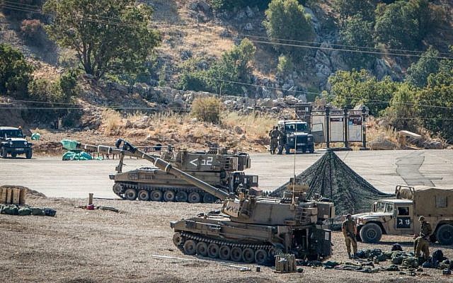 Israeli soldiers with their artillery unit on high alert seen near the Israeli-Syrian border, in the Golan Heights, on Aug. 25, 2019. (Basel Awidat/Flash90) Israeli soldiers with their artillery unit on high alert seen near the Israeli-Syrian border, in the Golan Heights, on Aug. 25, 2019. (Basel Awidat/Flash90)