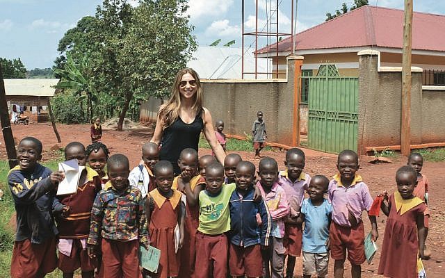 Author Suzy Zail with
schoolchildren in
Uganda during her
2015 research trip. Author Suzy Zail with
schoolchildren in
Uganda during her
2015 research trip.