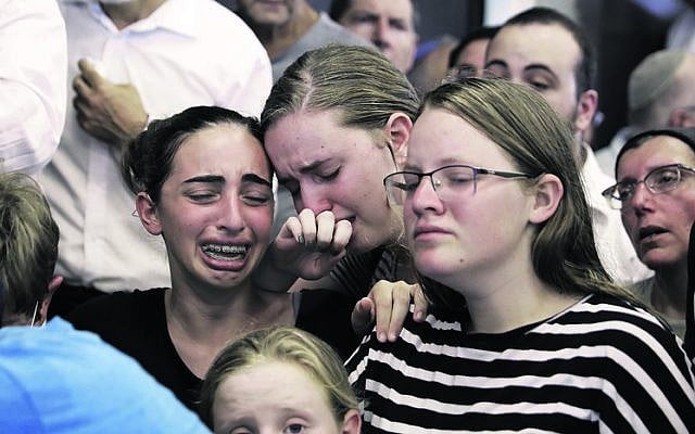 Mourners at the funeral of Rina Shnerb, in Lod. Photo: AP Photo/Sebastian Scheiner Mourners at the funeral of Rina Shnerb, in Lod. Photo: AP Photo/Sebastian Scheiner