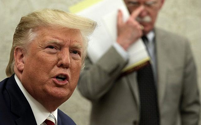 President Donald Trump speaks to members of the media as National Security Adviser John Bolton listens during a meeting with Romanian President Klaus Iohannis at the White House, Aug. 20, 2019. (Alex Wong/Getty Images) President Donald Trump speaks to members of the media as National Security Adviser John Bolton listens during a meeting with Romanian President Klaus Iohannis at the White House, Aug. 20, 2019. (Alex Wong/Getty Images)
