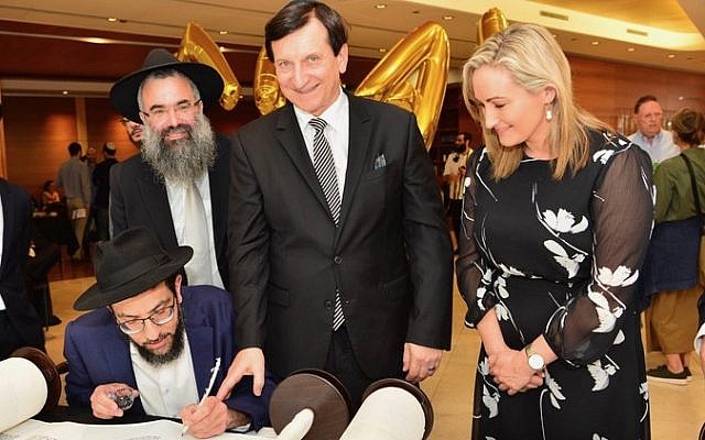 From left: Scribe Rabbi Shlomo Israel (seated) completing a Torah while Rabbi Slavin, Heffron MP Ron Hoenig and Coogee MP Dr Marjorie O'Neill look on. Photo: Henry Benjamin From left: Scribe Rabbi Shlomo Israel (seated) completing a Torah while Rabbi Slavin, Heffron MP Ron Hoenig and Coogee MP Dr Marjorie O'Neill look on. Photo: Henry Benjamin