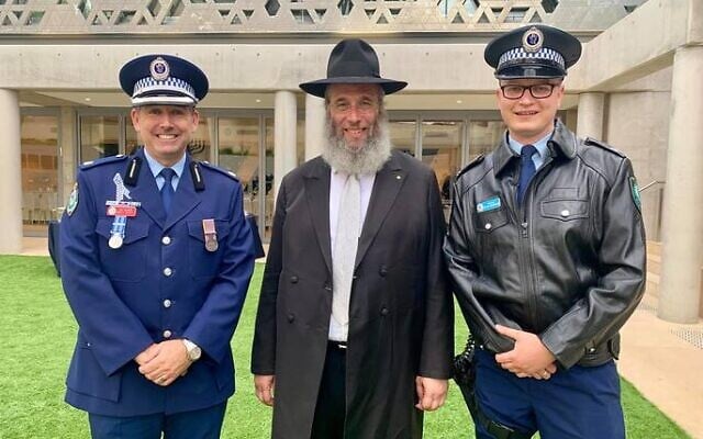 From left: Chief Inspector Matt
Scott, Rabbi Mendel Kastel and
Constable Peter Woodward. From left: Chief Inspector Matt
Scott, Rabbi Mendel Kastel and
Constable Peter Woodward.