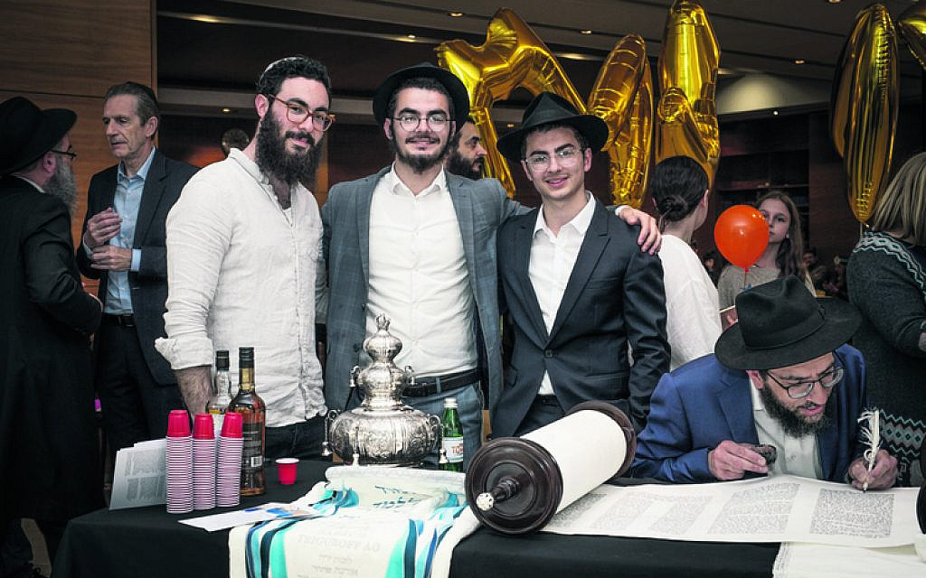 From left: Zevi, Mendel and Shlomie Slavin.