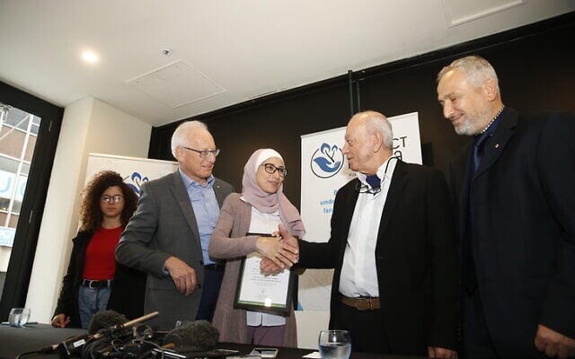From left: Noor Maasarwe, Ron Finkel, Dr Khadra Hasan Ali Salami, Saeed
Maasarwe and Project Rozana board member Dr Jamal Rifi. Photo: Yuri Kouzmin. From left: Noor Maasarwe, Ron Finkel, Dr Khadra Hasan Ali Salami, Saeed
Maasarwe and Project Rozana board member Dr Jamal Rifi. Photo: Yuri Kouzmin.