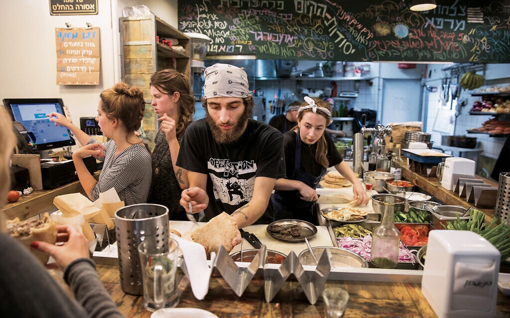A hive of activity at
Miznon in Tel Aviv. A hive of activity at
Miznon in Tel Aviv.
