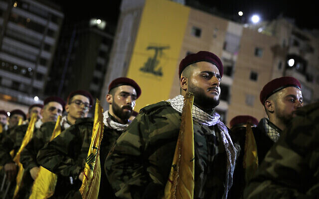 Hezbollah fighters stand in formation. Photo: AP Photo/Hassan Ammar Hezbollah fighters stand in formation. Photo: AP Photo/Hassan Ammar