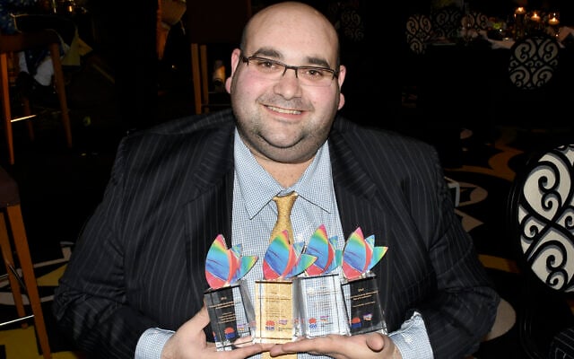 Joshua Levi proudly displays his
accolades at the 2016 NSW Premier’s
Multicultural Media Awards.
Photo: Noel Kessel Joshua Levi proudly displays his
accolades at the 2016 NSW Premier’s
Multicultural Media Awards.
Photo: Noel Kessel