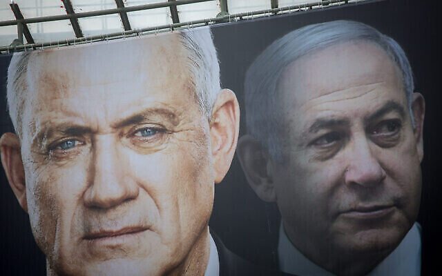 Election posters put up by Blue and White show candidates Benny Gantz (left) and Benjamin Netanyahu on February 18, 2020. (Miriam Alster/Flash90) Election posters put up by Blue and White show candidates Benny Gantz (left) and Benjamin Netanyahu on February 18, 2020. (Miriam Alster/Flash90)