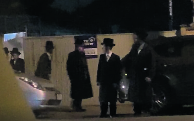 A screen grab of video taken of participants in last week’s minyan in Melbourne. A screen grab of video taken of participants in last week’s minyan in Melbourne.