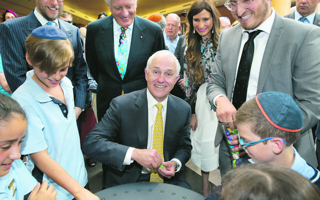 Malcolm Turnbull playing dreidel at Central Synagogue in 2015. Photo: Noel Kessel Malcolm Turnbull playing dreidel at Central Synagogue in 2015. Photo: Noel Kessel