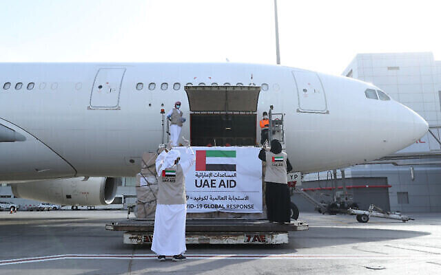 An Etihad Airways flight with aid for the Palestinians to fight the coronavirus pandemic is loaded with its cargo in Abu Dhabi on May 19, 2020. Photo: WAM via AP An Etihad Airways flight with aid for the Palestinians to fight the coronavirus pandemic is loaded with its cargo in Abu Dhabi on May 19, 2020. Photo: WAM via AP