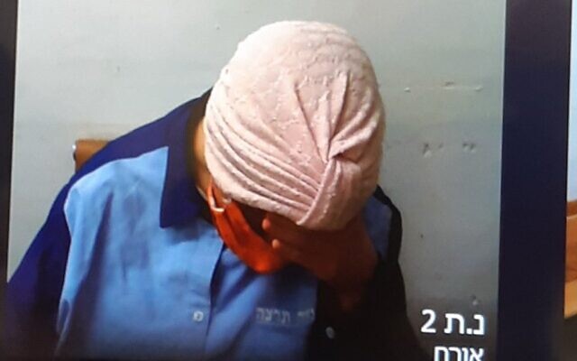 Malka Leifer refuses to raise her head while appearing over Skype during an extradition hearing at the Jerusalem District Court on July 20, 2020. Photo: Jacob Magid/Times of Israel Malka Leifer refuses to raise her head while appearing over Skype during an extradition hearing at the Jerusalem District Court on July 20, 2020. Photo: Jacob Magid/Times of Israel