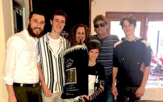 Rabbi Ari Rubin (left) with the Knezevick family. Rabbi Ari Rubin (left) with the Knezevick family.