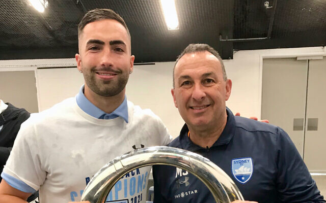 Jordi Swibel (left) holding the trophy
with his dad Michael. Jordi Swibel (left) holding the trophy
with his dad Michael.