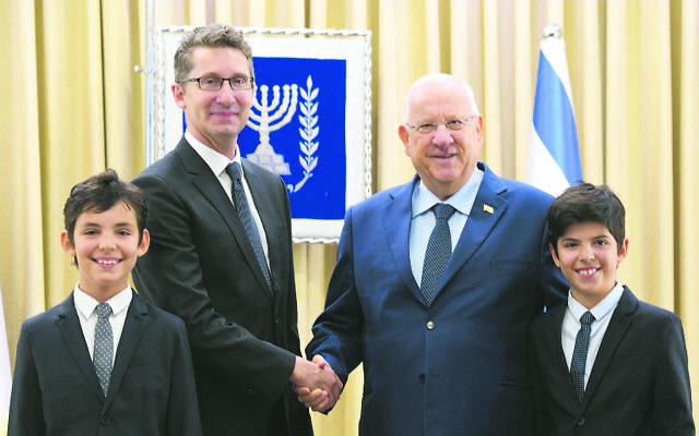 Chris Cannan with his twin sons Nicholas and Alexander and Reuven Rivlin in 2017. Chris Cannan with his twin sons Nicholas and Alexander and Reuven Rivlin in 2017.