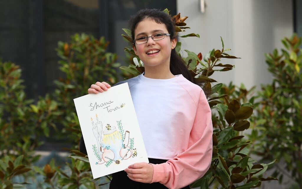Leah Spivak with her winning card. Photo: Peter Haskin Leah Spivak with her winning card. Photo: Peter Haskin