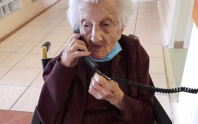 Rosalie Wolpe speaks to a relative on the phone on her 111th birthday at a retirement home in Cape Town, South Africa on August 25, 2020. Rosalie Wolpe speaks to a relative on the phone on her 111th birthday at a retirement home in Cape Town, South Africa on August 25, 2020.