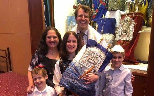 Daniel Aghion with his wife Jenny, sons Joseph and Ben, and daughter
Michelle, preparing to celebrate Michelle’s bat mitzvah at Temple Beth Israel. Daniel Aghion with his wife Jenny, sons Joseph and Ben, and daughter
Michelle, preparing to celebrate Michelle’s bat mitzvah at Temple Beth Israel.