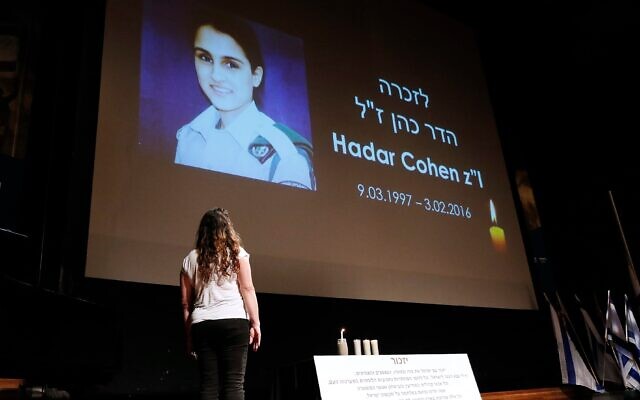 Orit Brand lights a candle for Hadar Cohen, an IDF soldier killed by terrorists
in Jerusalem. Photo: Peter Haskin Orit Brand lights a candle for Hadar Cohen, an IDF soldier killed by terrorists
in Jerusalem. Photo: Peter Haskin