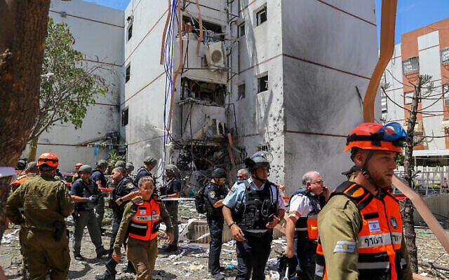 Rescue services are seen at a building in the southern port city of Ashdod that was hit by a rocket fired by Palestinian terrorists in the Gaza Strip, May 17, 2021. Photo: Flash90 Rescue services are seen at a building in the southern port city of Ashdod that was hit by a rocket fired by Palestinian terrorists in the Gaza Strip, May 17, 2021. Photo: Flash90