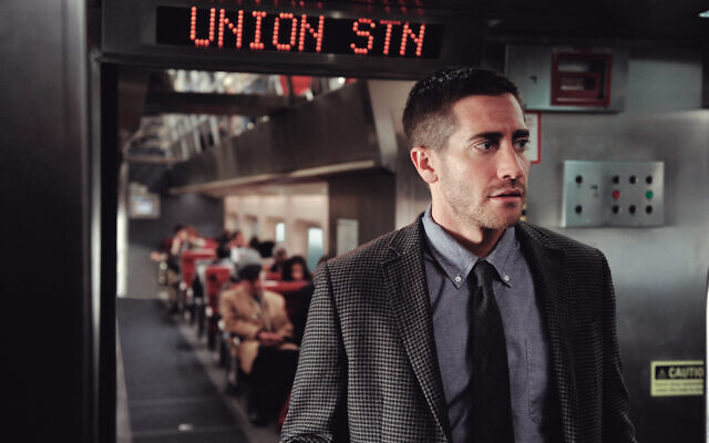 Jake Gyllenhaal in a scene from 2011 movie Source Code. Jake Gyllenhaal in a scene from 2011 movie Source Code.