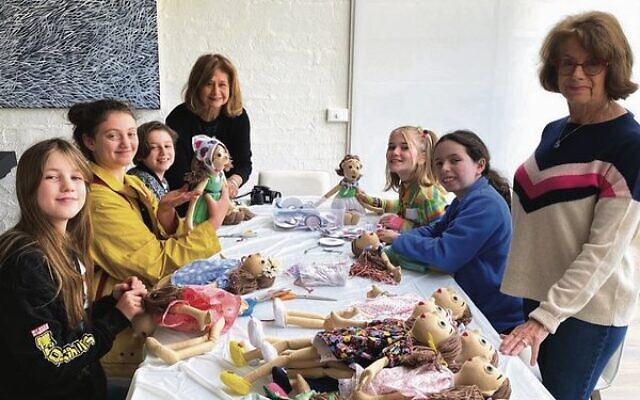 Our Kitchen Table volunteers dress the care dolls. Our Kitchen Table volunteers dress the care dolls.