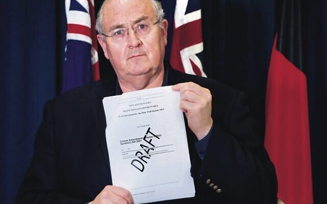 NSW shadow police minister Walt Secord with the draft bill. NSW shadow police minister Walt Secord with the draft bill.