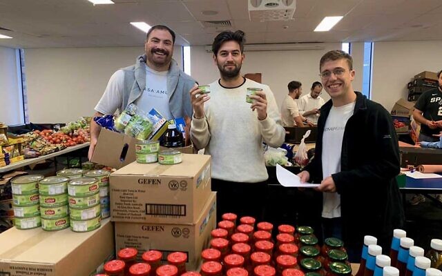 Brent Shapiro, Daniel Sacks, Alan Lewis creating and distributing boxes on Pesach this year. Brent Shapiro, Daniel Sacks, Alan Lewis creating and distributing boxes on Pesach this year.