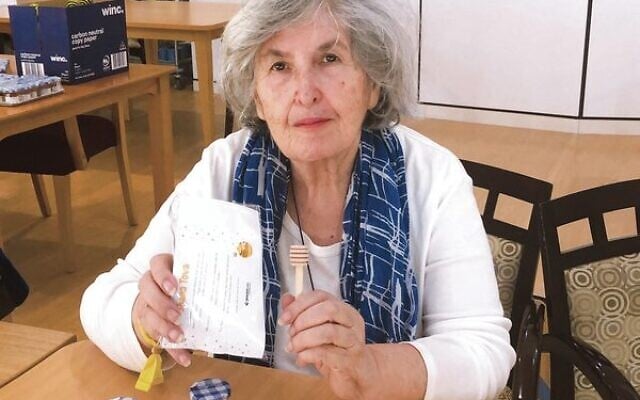 Gary Smorgon House resident Shirley Leivenzon making Rosh Hashanah gift packs. Gary Smorgon House resident Shirley Leivenzon making Rosh Hashanah gift packs.