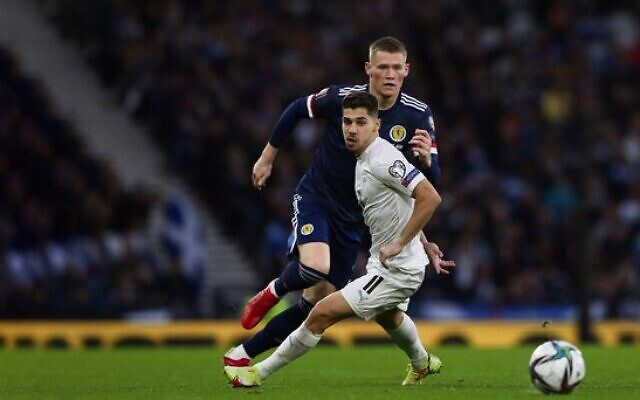 Israel's Manor Solomon (front) eyes the ball in a World Cup qualifying match against Scotland in Glasgow on October 9. Photo: AP Photo/Scott Heppell Israel's Manor Solomon (front) eyes the ball in a World Cup qualifying match against Scotland in Glasgow on October 9. Photo: AP Photo/Scott Heppell