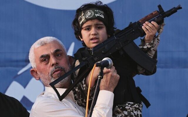 Hamas leader Yahya Sinwar holds the child of an Al-Qassam Brigades fighter, killed in the May 2021 conflict with Israel, during a rally in Gaza.
Photo: Emmanuel Dunand/AFP Hamas leader Yahya Sinwar holds the child of an Al-Qassam Brigades fighter, killed in the May 2021 conflict with Israel, during a rally in Gaza.
Photo: Emmanuel Dunand/AFP