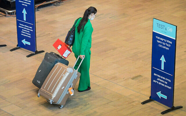 A traveller at Ben Gurion International Airport on November 28, 2021. Photo: Flash90 A traveller at Ben Gurion International Airport on November 28, 2021. Photo: Flash90