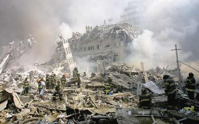 Firefighters make their way through the rubble of New York's Twin Towers after the 9/11 attacks in 2001. Photo: AP Photo/Shawn Baldwin Firefighters make their way through the rubble of New York's Twin Towers after the 9/11 attacks in 2001. Photo: AP Photo/Shawn Baldwin
