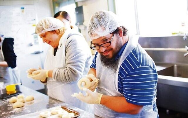 Plain or poppy seed? Sharon Breuer and David Ekman hard at work making bagels at the Access Inc bakery. Plain or poppy seed? Sharon Breuer and David Ekman hard at work making bagels at the Access Inc bakery.