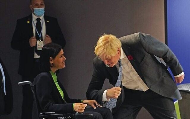 Boris Johnson (right) greets Karine Elharrar at COP26 in Glasgow on Tuesday.
Photo: Alberto Pezzali /AFP) Boris Johnson (right) greets Karine Elharrar at COP26 in Glasgow on Tuesday.
Photo: Alberto Pezzali /AFP)