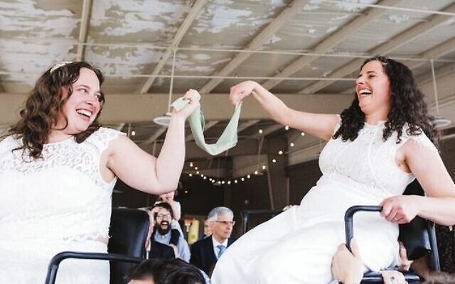 Rabbis Becca Walker (left) and Ariella Rosen at their wedding.
Photo: Kelly Prizel Photography Rabbis Becca Walker (left) and Ariella Rosen at their wedding.
Photo: Kelly Prizel Photography