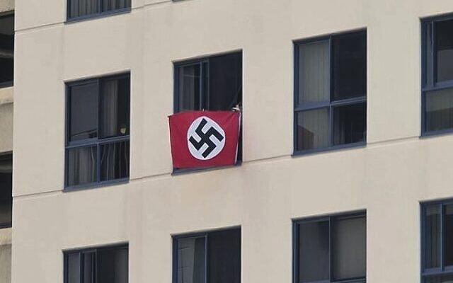 A Nazi flag flown from an apartment window overlooking Brisbane Synagogue in 2021. Photo: Reddit A Nazi flag flown from an apartment window overlooking Brisbane Synagogue in 2021. Photo: Reddit